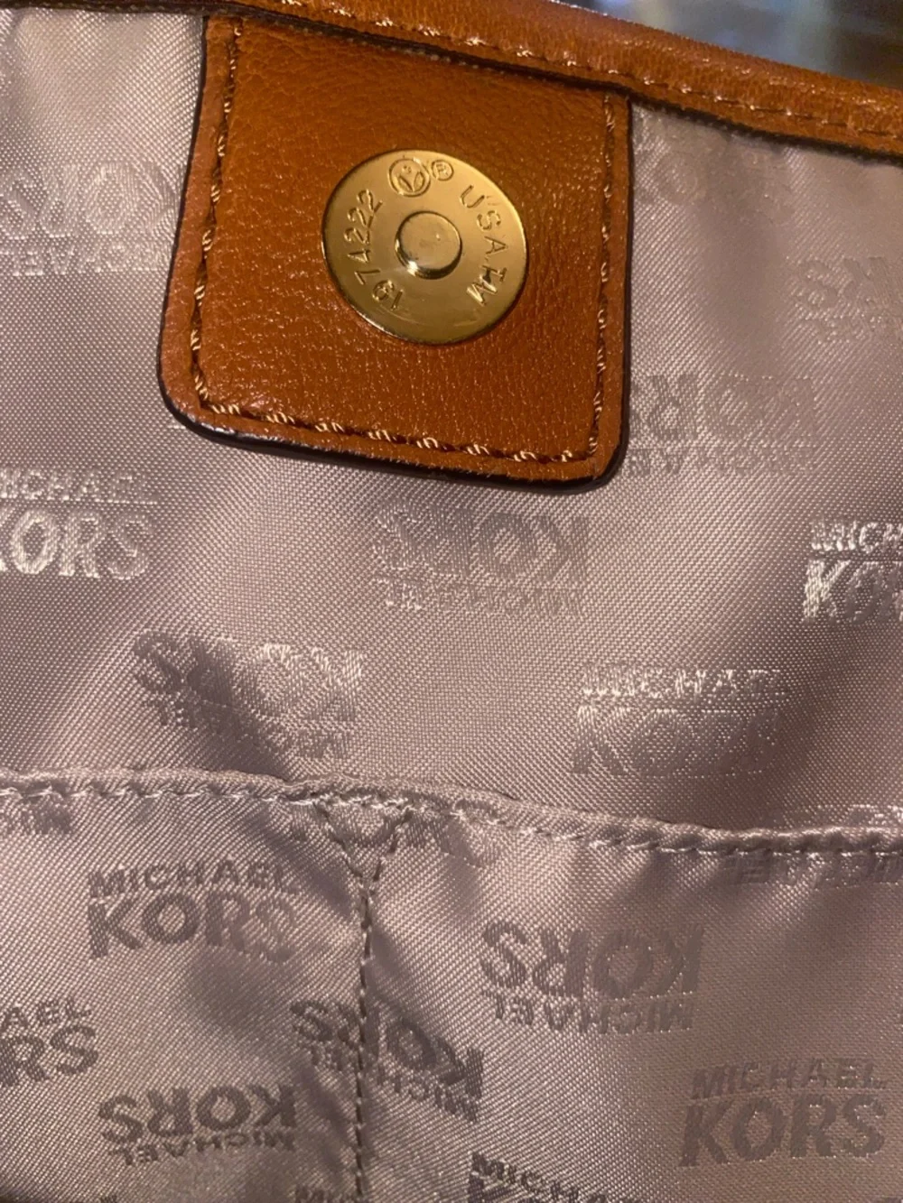 Michael Kors Raffia Tote with Tan Leather Trim and handles.